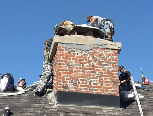 Somers Chimney Sweep installing a custom chimney crown in Somers, CT