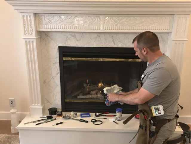 Somers Chimney Sweep performing fireplace maintenance in Somers, CT
