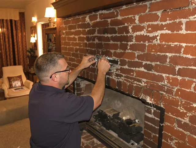 Somers Chimney Sweep expert fixing a fireplace in Somers, CT